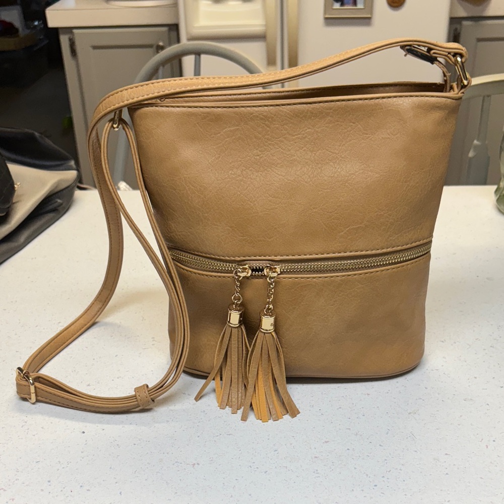 Elegant Tan Crossbody Bag with Tassel Details